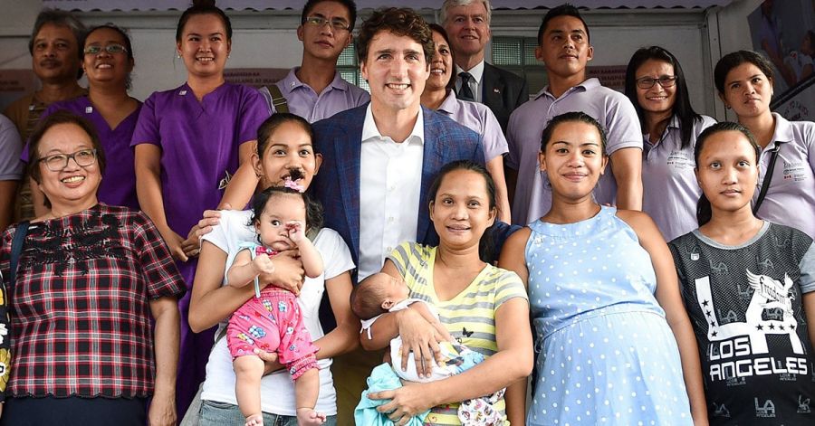 Trudeau with women and children.