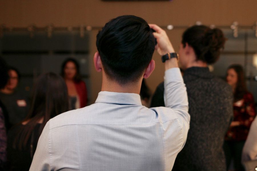 young man taking a selfie at a networking event 