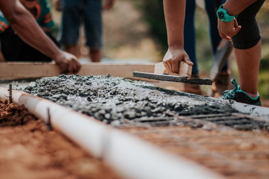 volunteers building a house foundation 